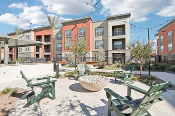 Our apartments offer a patio with chairs and fire pit
